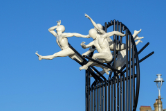 Flight of the Langoustine, by Pierre Diamantopoulo MRSS. It is made of four life-size bronze figures flying through a steel grid. It was inspired by a discarded and mangled lobster pot that the artist had found on Brighton beach. In his imagination, the washed-up object that had seemingly helped the lobsters escape, translated itself into a wider story of human exodus and release – a dash for freedom. Diamantopoulo describes the figures as “at once profound, frivolous and boisterous, occupying the air like a flock of birds and inspired by modern dance choreography”. Bronze casting at Milwyn Foundry and fabrication of the steel grid and assembly by Art Fabrications. The sculpture weighs 2.2 tonnes and measures approximately 3.5 metres high and 3 meters wide. Flight of the Langoustine was inaugurated on the Hove Plinth on 17 September 2023. Flight of the Langoustine, by Pierre Diamantopoulo MRSS. It is made of four life-size bronze figures flying through a steel grid. It was inspired by a discarded and mangled lobster pot that the artist had found on Brighton beach. In his imagination, the washed-up object that had seemingly helped the lobsters escape, translated itself into a wider story of human exodus and release – a dash for freedom. Diamantopoulo describes the figures as “at once profound, frivolous and boisterous, occupying the air like a flock of birds and inspired by modern dance choreography”. Bronze casting at Milwyn Foundry and fabrication of the steel grid and assembly by Art Fabrications. The sculpture weighs 2.2 tonnes and measures approximately 3.5 metres high and 3 meters wide. Flight of the Langoustine was inaugurated on the Hove Plinth on 17 September 2023.