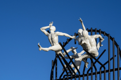 Flight of the Langoustine, by Pierre Diamantopoulo MRSS. It is made of four life-size bronze figures flying through a steel grid. It was inspired by a discarded and mangled lobster pot that the artist had found on Brighton beach. In his imagination, the washed-up object that had seemingly helped the lobsters escape, translated itself into a wider story of human exodus and release – a dash for freedom. Diamantopoulo describes the figures as “at once profound, frivolous and boisterous, occupying the air like a flock of birds and inspired by modern dance choreography”. Bronze casting at Milwyn Foundry and fabrication of the steel grid and assembly by Art Fabrications. The sculpture weighs 2.2 tonnes and measures approximately 3.5 metres high and 3 meters wide. Flight of the Langoustine was inaugurated on the Hove Plinth on 17 September 2023. Flight of the Langoustine, by Pierre Diamantopoulo MRSS. It is made of four life-size bronze figures flying through a steel grid. It was inspired by a discarded and mangled lobster pot that the artist had found on Brighton beach. In his imagination, the washed-up object that had seemingly helped the lobsters escape, translated itself into a wider story of human exodus and release – a dash for freedom. Diamantopoulo describes the figures as “at once profound, frivolous and boisterous, occupying the air like a flock of birds and inspired by modern dance choreography”. Bronze casting at Milwyn Foundry and fabrication of the steel grid and assembly by Art Fabrications. The sculpture weighs 2.2 tonnes and measures approximately 3.5 metres high and 3 meters wide. Flight of the Langoustine was inaugurated on the Hove Plinth on 17 September 2023.