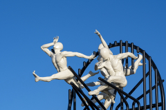 Flight of the Langoustine, by Pierre Diamantopoulo MRSS. It is made of four life-size bronze figures flying through a steel grid. It was inspired by a discarded and mangled lobster pot that the artist had found on Brighton beach. In his imagination, the washed-up object that had seemingly helped the lobsters escape, translated itself into a wider story of human exodus and release – a dash for freedom. Diamantopoulo describes the figures as “at once profound, frivolous and boisterous, occupying the air like a flock of birds and inspired by modern dance choreography”. Bronze casting at Milwyn Foundry and fabrication of the steel grid and assembly by Art Fabrications. The sculpture weighs 2.2 tonnes and measures approximately 3.5 metres high and 3 meters wide. Flight of the Langoustine was inaugurated on the Hove Plinth on 17 September 2023. Flight of the Langoustine, by Pierre Diamantopoulo MRSS. It is made of four life-size bronze figures flying through a steel grid. It was inspired by a discarded and mangled lobster pot that the artist had found on Brighton beach. In his imagination, the washed-up object that had seemingly helped the lobsters escape, translated itself into a wider story of human exodus and release – a dash for freedom. Diamantopoulo describes the figures as “at once profound, frivolous and boisterous, occupying the air like a flock of birds and inspired by modern dance choreography”. Bronze casting at Milwyn Foundry and fabrication of the steel grid and assembly by Art Fabrications. The sculpture weighs 2.2 tonnes and measures approximately 3.5 metres high and 3 meters wide. Flight of the Langoustine was inaugurated on the Hove Plinth on 17 September 2023.