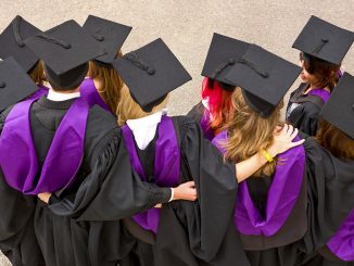 Graduates celebrating after UCL ceremony.